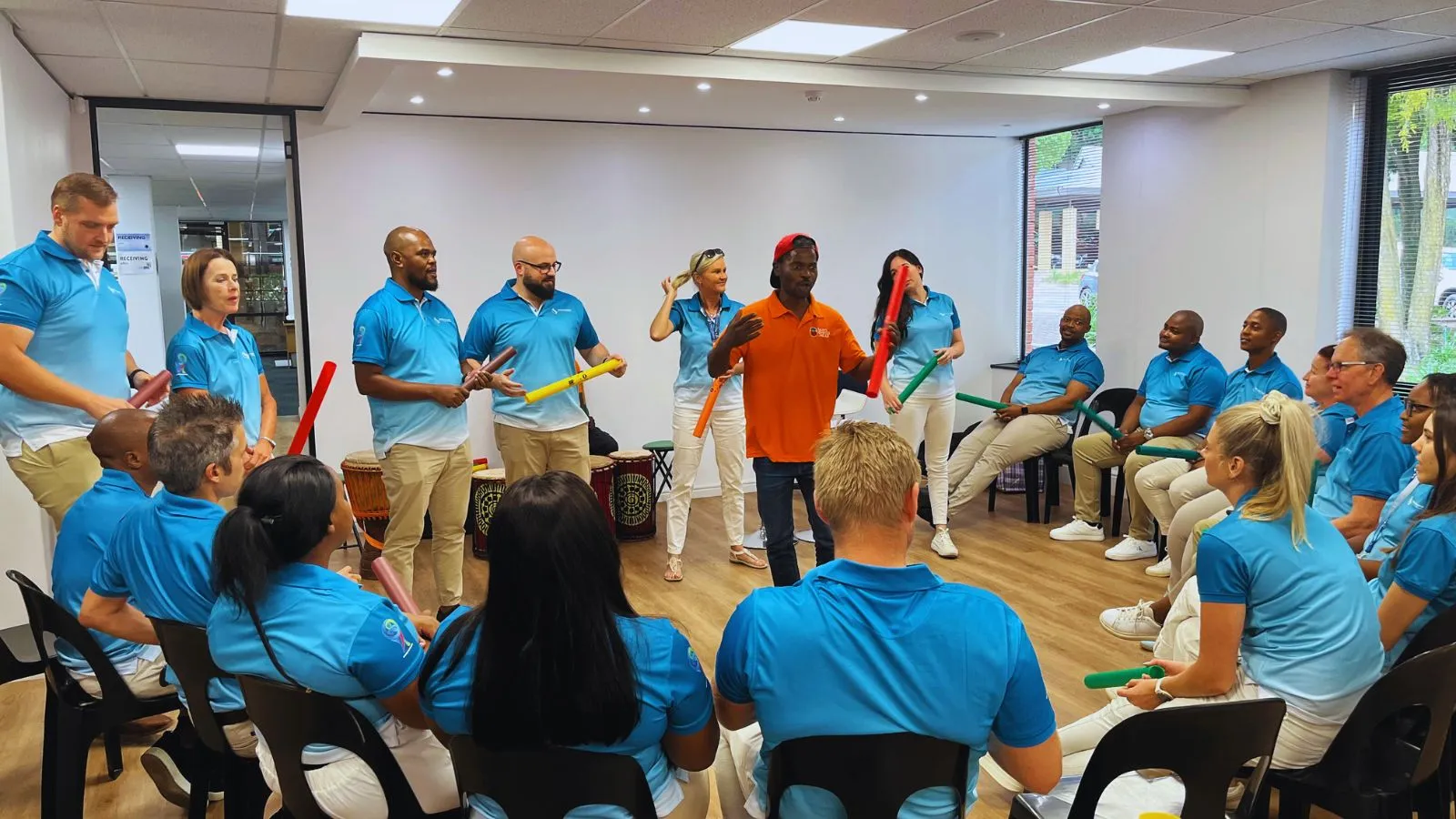 Selective Surgical boomwhackers team building Johannesburg office drumming activity with employees creating music together