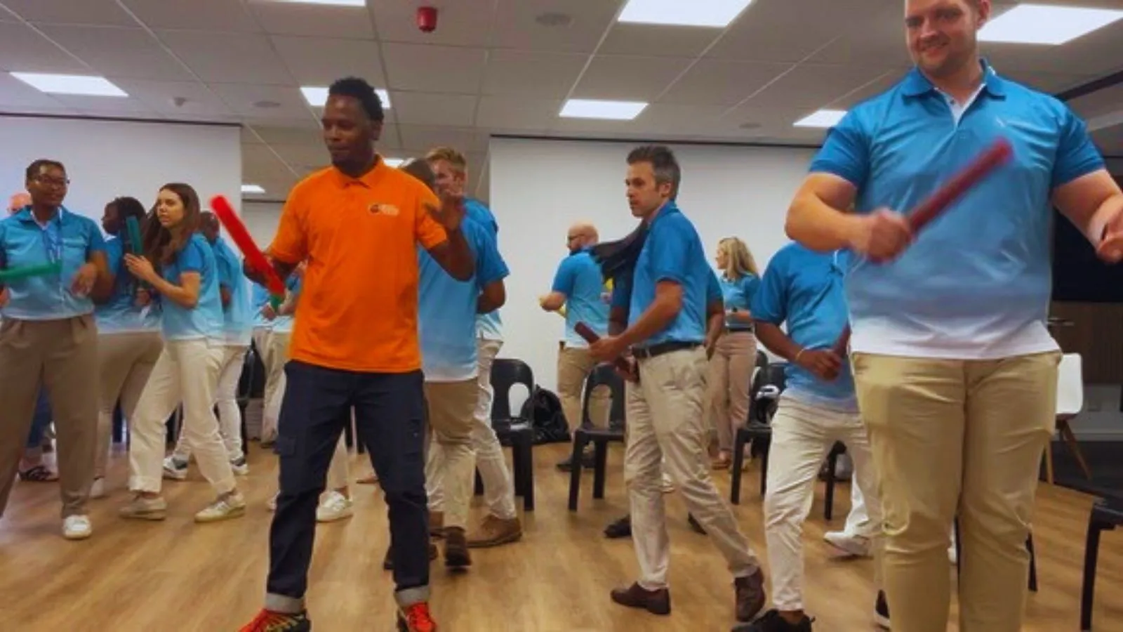 corporate team participating in survivor team building Johannesburg completing outdoor challenges and group activities