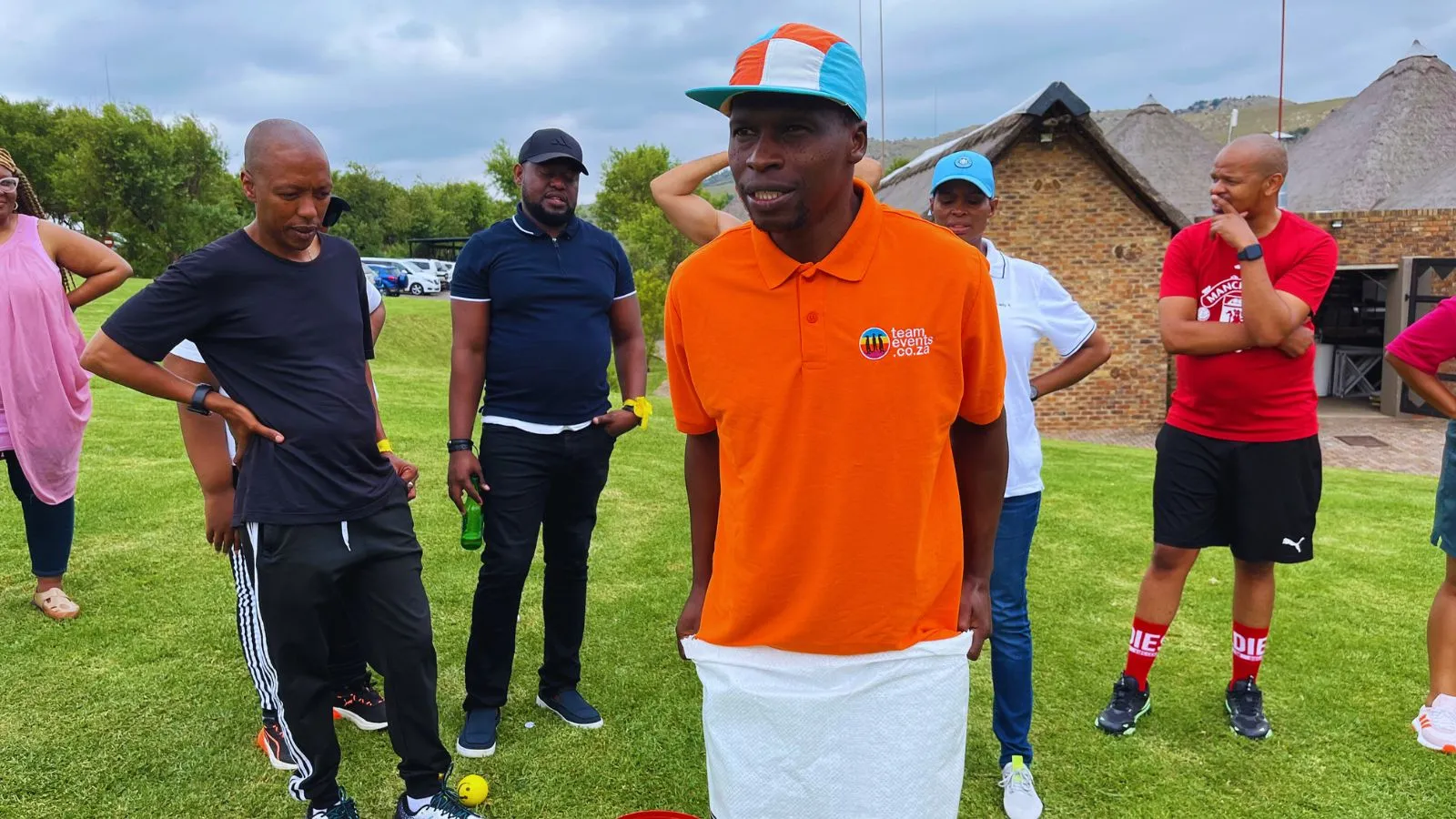 corporate team participating in survivor team building Johannesburg completing outdoor challenges and group activities