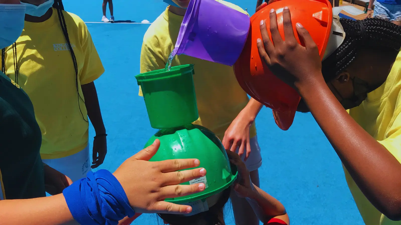 A team Completing a wet and wacky challenge